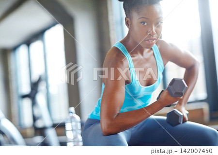Black woman, weight lifting and portrait in gym for workout with dumbbell, fitness challenge and strong muscle. Bodybuilder, athlete and strength training with confidence, mockup and power exercise Black woman, weight lifting and portrait in gym for workout with dumbbell, fitness challenge and strong muscle. Bodybuilder, athlete and strength training with confidence, mockup and power exercise 142007450
