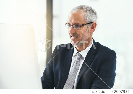 Computer, glasses and mature businessman in office for web, research and b2b, client or communication. Pc, review and CEO reading company newsletter, planning or checking email, schedule or feedback 142007986