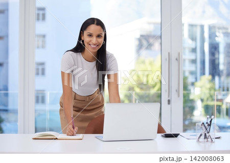 Book, laptop and portrait of woman at desk with reminder, schedule and brainstorming for article. Happy, writer and smile with digital technology at work for research, information and idea on report Book, laptop and portrait of woman at desk with reminder, schedule and brainstorming for article. Happy, writer and smile with digital technology at work for research, information and idea on report 142008063