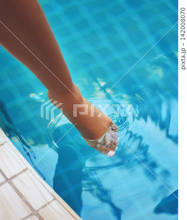 Hotel, foot and swimming in pool, luxury and holiday in summer, travel and relax for person in trip. Tourist, vacation and outdoor for water, calm and blue in color, toes and paradise in Maldives Hotel, foot and swimming in pool, luxury and holiday in summer, travel and relax for person in trip. Tourist, vacation and outdoor for water, calm and blue in color, toes and paradise in Maldives 142008070