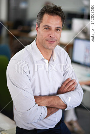 Businessman, office and table in portrait with arms crossed in for job in workplace for startup. Male person, manager and happy on desk with technology in company with entrepreneur pride 142008506