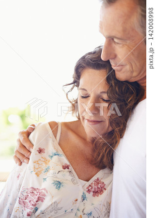 Couple, home and mature people with hug for love, support and together for comfort. Relationship, commitment and bonding for romance with soulmate, care and affection for wellness and wellbeing Couple, home and mature people with hug for love, support and together for comfort. Relationship, commitment and bonding for romance with soulmate, care and affection for wellness and wellbeing 142008998