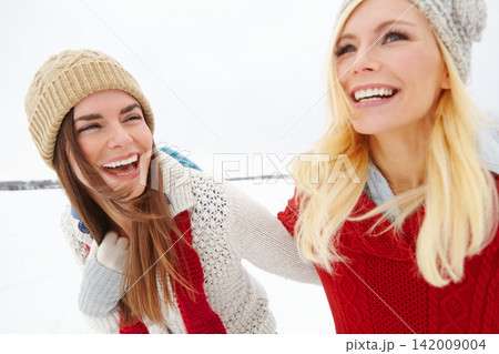 Travel, laughing and lesbian couple outdoor in snow on romantic vacation, adventure or holiday. Love, smile and queer women in relationship for bonding in winter weather on weekend trip in Iceland. 142009004