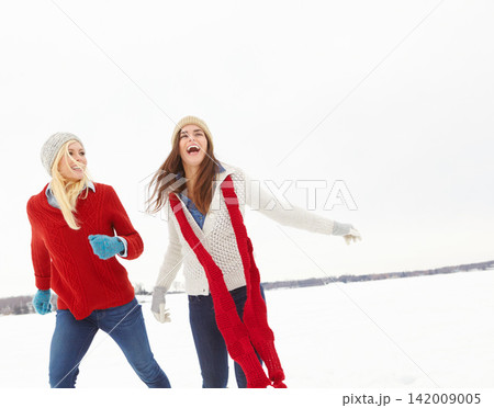Winter, smile and friends with laughing in snow for vacation, weekend trip and holiday in Canada. Happy, women and journey with funny conversation in cold weather for travel, adventure and tourism 142009005