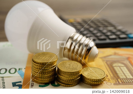 Cost of electric utilities with light bulb for payment. Cost of electric utilities with light bulb for payment. 142009018