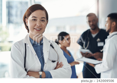 Doctor, portrait and arms crossed in clinic or medical meeting with confidence, integrity and about us. Face of healthcare person in leadership and happy for workflow, advice and planning in hospital 142009506