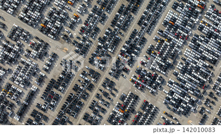 Aerial view new car lined up, Automobile automotive car parking lot commercial business industry, Port of import export business logistic dealership, New cars global business logistic import export. Aerial view new car lined up, Automobile automotive car parking lot commercial business industry, Port of import export business logistic dealership, New cars global business logistic import export. 142010083