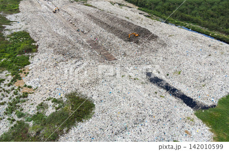 Aerial view landfill garbage waste huge dump environmental pollution problem 142010599