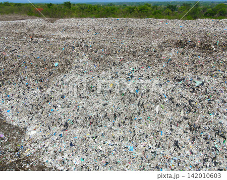 Aerial view landfill garbage waste huge dump environmental pollution problem, Top view on plastic and other industrial waste ecological disaster from above with garbage sorting garbage disposal Aerial view landfill garbage waste huge dump environmental pollution problem, Top view on plastic and other industrial waste ecological disaster from above with garbage sorting garbage disposal 142010603