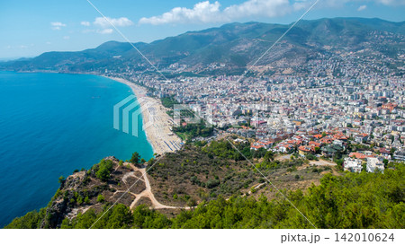 Alanya beach top view on the mountain with coast on blue sea and harbor city background - Beautiful cleopatra beach Alanya Turkey landscape travel landmark Alanya beach top view on the mountain with coast on blue sea and harbor city background - Beautiful cleopatra beach Alanya Turkey landscape travel landmark 142010624