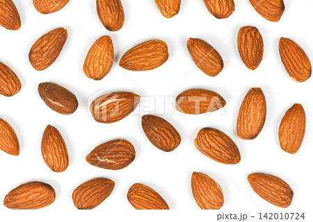 Almonds seamless texture background / Close up almond nuts natural protein food and for snack Almonds seamless texture background / Close up almond nuts natural protein food and for snack 142010724