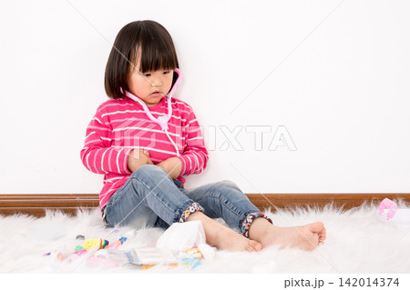 Toddler Girl Playing as a Doctor, Child Dreaming of Career, Healthcare Awareness and Early Childhood Imagination Toddler Girl Playing as a Doctor, Child Dreaming of Career, Healthcare Awareness and Early Childhood Imagination 142014374