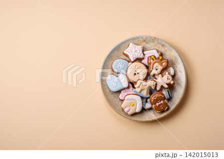 Gingerbread as a Christmas staple, sweet biscuits for the holiday. Gingerbread as a background Gingerbread as a Christmas staple, sweet biscuits for the holiday. Gingerbread as a background 142015013