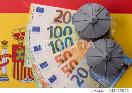 Liquefied gas storage tanks set against the Spanish flag, as a background for your design Liquefied gas storage tanks set against the Spanish flag, as a background for your design 142015046