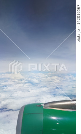 Airplane View of Clouds and Sky From Above Plane Engine Airplane View of Clouds and Sky From Above Plane Engine 142016567