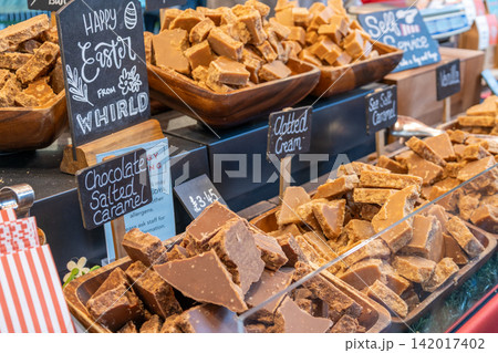 Assorted handmade fudge display on a market stall Assorted handmade fudge display on a market stall 142017402