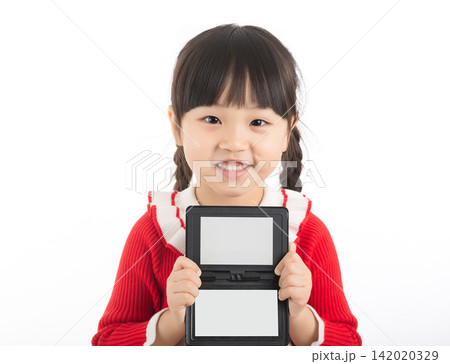 Smiling East Asian child holding a blank small blackboard frame for copy space. Smiling East Asian child holding a blank small blackboard frame for copy space. 142020329