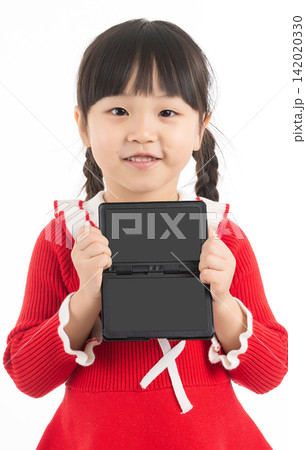 Smiling East Asian child holding a blank small blackboard frame for copy space. Smiling East Asian child holding a blank small blackboard frame for copy space. 142020330