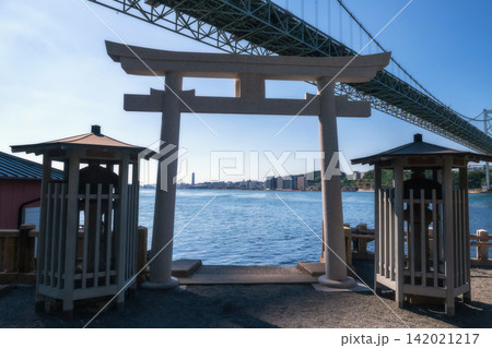 Torii gate of Mekari Shrine by Kanmon bridge, Kitakyushu, Japan 142021217