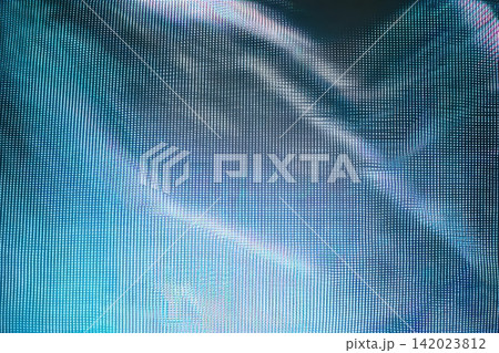 Glitch pattern displayed on a large LED screen during an event at night 142023812