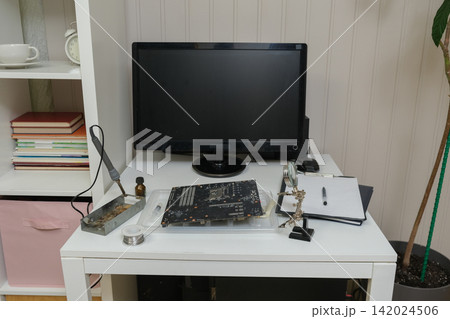 Equipment for recording music in the home studio, guitar, headphones, laptop. Leisure, music and people concept. Workspace with laptop and acoustic guitar on wooden table. Musician online learning Equipment for recording music in the home studio, guitar, headphones, laptop. Leisure, music and people concept. Workspace with laptop and acoustic guitar on wooden table. Musician online learning 142024506