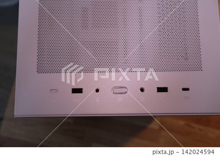Close-up of Electronic Device Ports and Perforated Panel Close-up of Electronic Device Ports and Perforated Panel 142024594