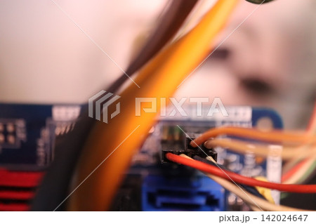 Close-up of Electronic Wiring and Circuit Board Components 142024647