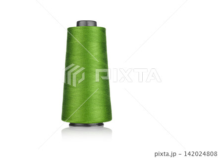 spool of industrial thread green color, texture of thread on a white background spool of industrial thread green color, texture of thread on a white background 142024808