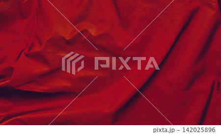 crimson silk fabric drape texture for luxury branding web design advertising background with elegant folds crimson silk fabric drape texture for luxury branding web design advertising background with elegant folds 142025896