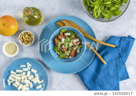 Vegan plate with lettuce, feta cheese, grapefruit, sesame and nuts Vegan plate with lettuce, feta cheese, grapefruit, sesame and nuts 142026017