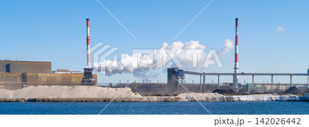 Heavy industrial steel plant with smoke emissions into the atmosphere. Wide panoramic view. Heavy industrial steel plant with smoke emissions into the atmosphere. Wide panoramic view. 142026442