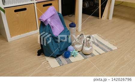 Sport Home exercise equipment. Efficient workout routine. Fitness gear placed for home fit. Yoga mat, roller, dumbbells on room floor ready for recovery session. Personal inventory for weight loss Sport Home exercise equipment. Efficient workout routine. Fitness gear placed for home fit. Yoga mat, roller, dumbbells on room floor ready for recovery session. Personal inventory for weight loss 142026796