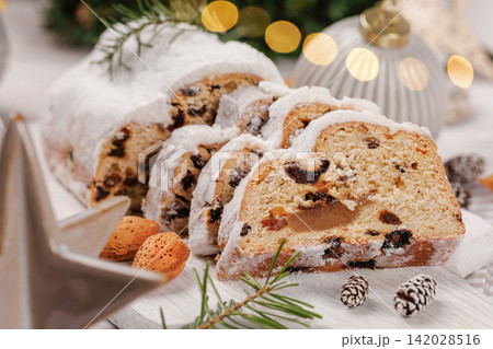 Sliced Christmas Stollen with Almonds and Ornaments Sliced Christmas Stollen with Almonds and Ornaments 142028516