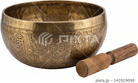 Tibetan singing bowl with wooden mallet and intricate carvings meditation spiritual relaxation instrument cultural isolated background container accessory Tibetan singing bowl with wooden mallet and intricate carvings meditation spiritual relaxation instrument cultural isolated background container accessory 142029098