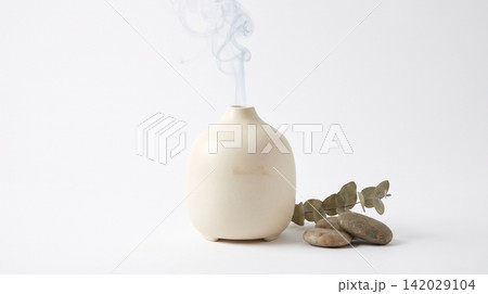 Ceramic essential oil diffuser with eucalyptus leaves diffuser aromatherapy essential wellness relaxation eucalyptus fragrance holistic interior atmosphere botanical lifestyle treatment 142029104