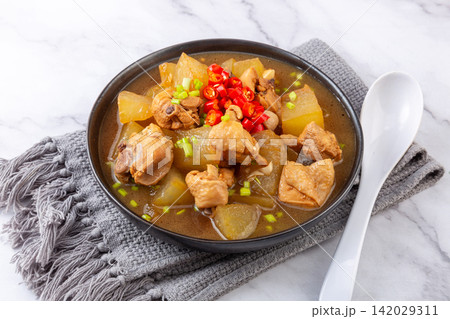braised Chicken with Winter Melon Chinese Soup Dish 142029311