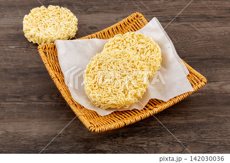 uncooked egg instant noodle cake block Asian ramen staple food uncooked egg instant noodle cake block Asian ramen staple food 142030036