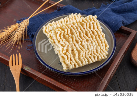 dried flat udon noodle cake block traditional Asian wheat pasta dried flat udon noodle cake block traditional Asian wheat pasta 142030039