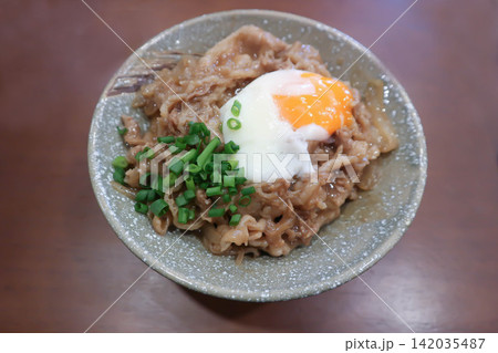 Rice topped with stir fried pork or stir fried beef and egg or Japanese food or Korean food or Beef Rice Bowl , Gyudon Rice topped with stir fried pork or stir fried beef and egg or Japanese food or Korean food or Beef Rice Bowl , Gyudon 142035487