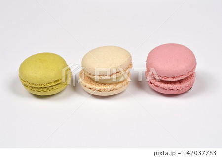 Three colorful macarons in a horizontal row 142037783