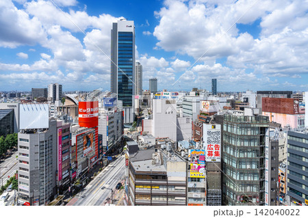 Modern city skyline and commercial street on sunny day in Toshima, Ikebukuro, Tokyo, Japan Modern city skyline and commercial street on sunny day in Toshima, Ikebukuro, Tokyo, Japan 142040022