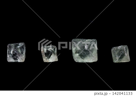 macro mineral fluorite stone on balck background macro mineral fluorite stone on balck background 142041133
