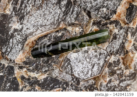 Macro stone tourmaline mineral on a black background 142041159