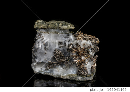 Macro stone mineral silver metal in the rock on a black background Macro stone mineral silver metal in the rock on a black background 142041163