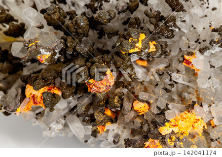 Macro of Realgar mineral stone on white background Macro of Realgar mineral stone on white background 142041174