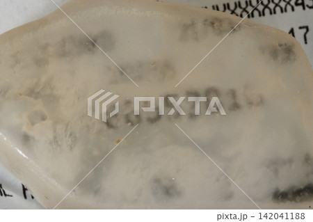 Macro stone mineral Ulexite on a black background 142041188