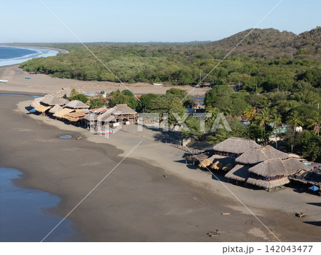 Bungalows on ocean beach 142043477