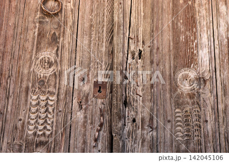 Close up brown wooden door texture Close up brown wooden door texture 142045106