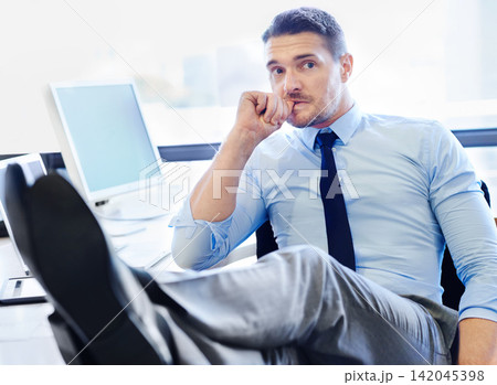 Businessman, thinking and tech in workplace with stress for corporate job, desk and feet up. Screen, executive and lawyer with nervous thoughts in office for web, shoes and anxiety for future career Businessman, thinking and tech in workplace with stress for corporate job, desk and feet up. Screen, executive and lawyer with nervous thoughts in office for web, shoes and anxiety for future career 142045398