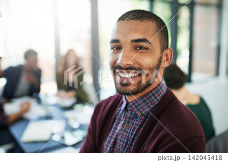 Portrait, man and meeting in modern office with people for lens flare, coworking and creative career. Face of male designer, work and confident at agency with smile for company, together and teamwork Portrait, man and meeting in modern office with people for lens flare, coworking and creative career. Face of male designer, work and confident at agency with smile for company, together and teamwork 142045418